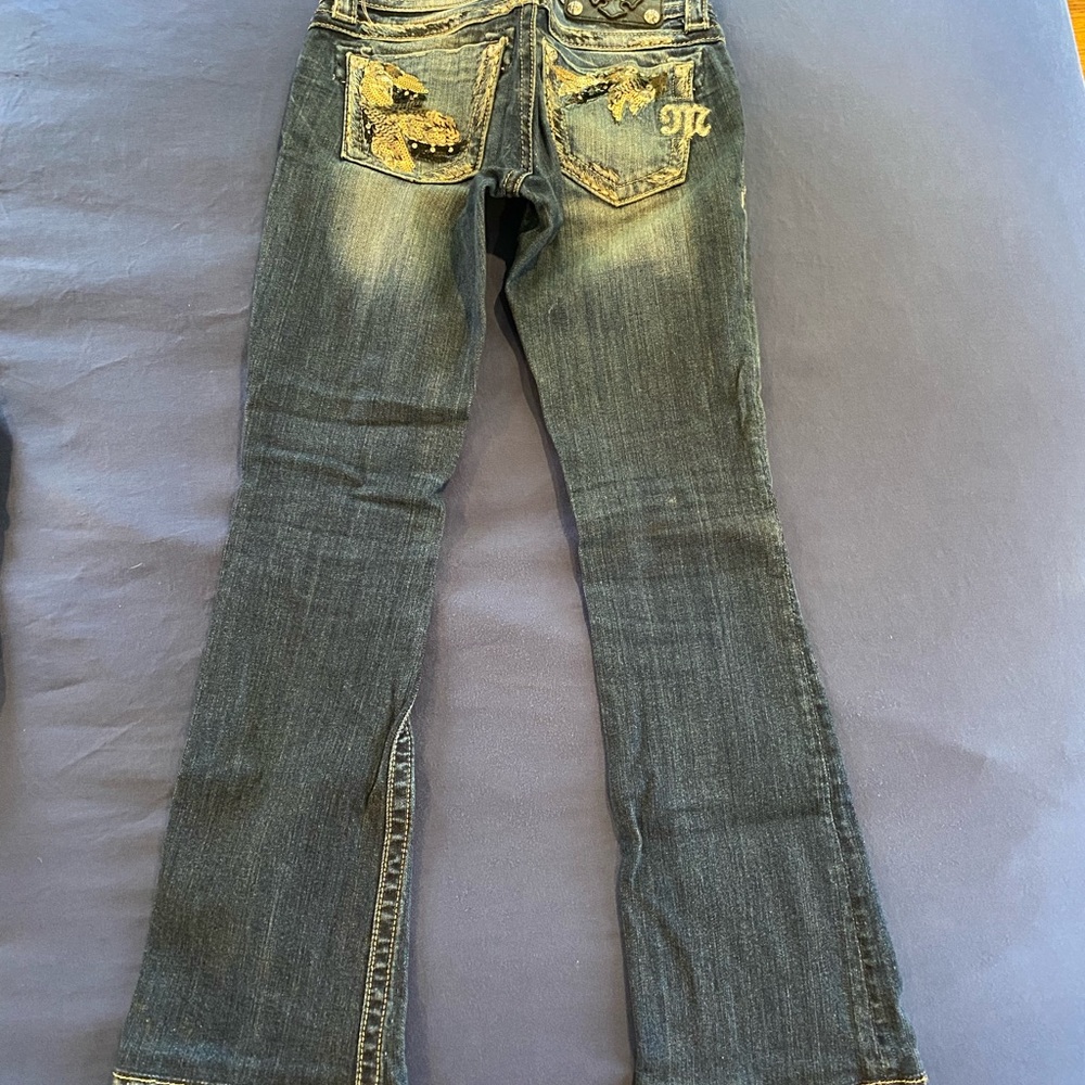 Dark wash Miss Me jeans.Great condition! Size is 24 with a 31 inch inseam